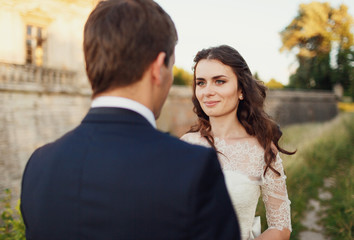 .attractive bride looking at the groom