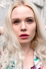 Young european blond woman outdoors portrait. Bright white colors.