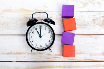 alarm clocks on wooden table