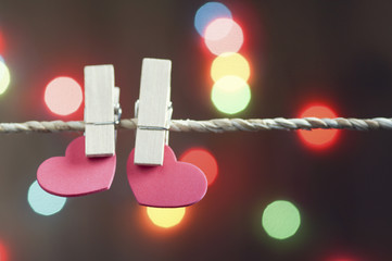 heart holding on rope with blur bokeh background