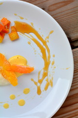 The orange dessert with cream and honey
