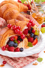 Fresh croissants and honey.