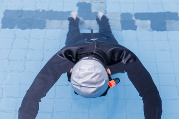 Free diving training on swimming pool