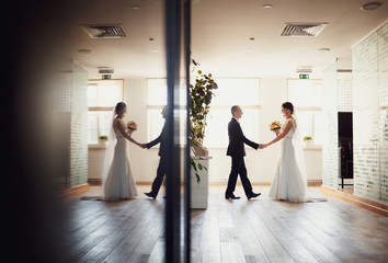 Fototapeta premium Newlyweds fooling around in the hotel