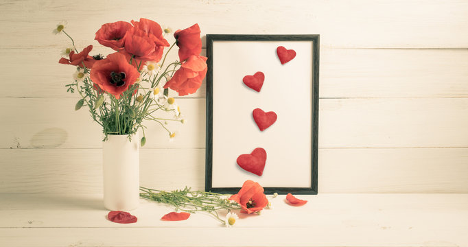 Card for Valentine Day. Red poppies bouquet in vase and freame