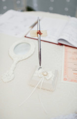 Beautiful pen and wedding accessories on the table