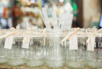 Jars with ribbons on the table