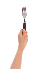 Woman hand holding a silver fork  isolated on white