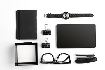 Mix of office supplies and business gadgets on a modern  desk