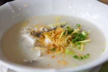Seabass congee with vegetable in bowl