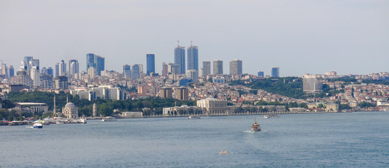 Obraz premium Skyscrapers and modern office buildings in Istanbul, Turkey. The Bosphorus or Straits of Istanbul is a strait separating the European part - from the Asian side: Anatolia of Turkey.