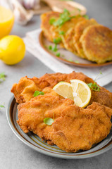 Delicious original schnitzel with potato pancakes