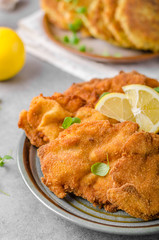 Delicious original schnitzel with potato pancakes