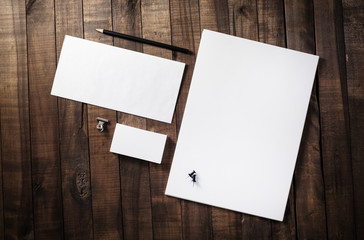Photo of blank corporate identity. Stationery set. Branding mockup. Sheets of paper, letterhead, business cards, envelope and pencil.