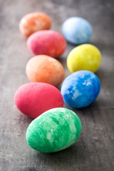 Colorful Easter eggs on wooden background
