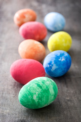 Fototapeta na wymiar Colorful Easter eggs on wooden background 