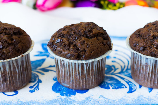 Three chocolate muffins with chocolate chips
