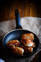 fried pork chops in a frying pan