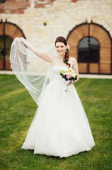 Fototapeta premium Lovely bride with flowers