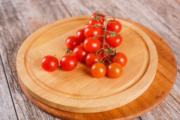 cherry tomatoes on a wooden board