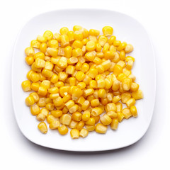 Сorn on a white plate isolated on white