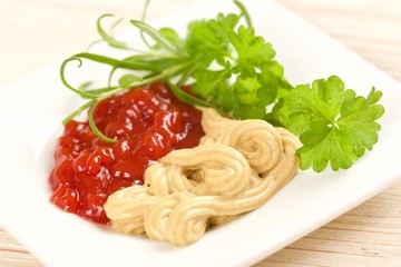 ketchup and mustard on a wooden background