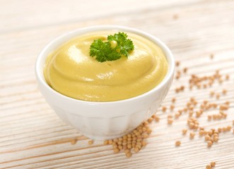 mustard on a wooden background