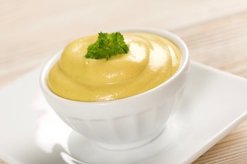 mustard on a wooden background