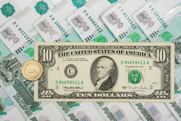 On the Russian ruble is 10 American dollars and coins with the inscription 
