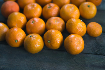 Fresh tangerine on a wooden board
