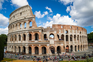 Fototapeta premium Colosseum with clear blue sky and clouds. Rome, Italy