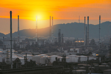 Aerial view oil refinery night with mountain background during twilight,Industrial zone,Energy power station.