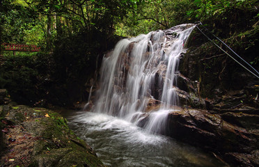 Naklejka premium A beautiful waterfall inside tropical rainforest. Long exposure and slow shutter