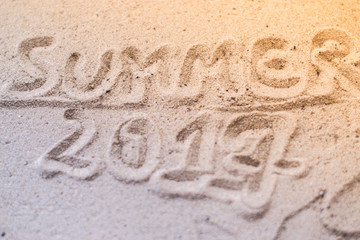Macro Summer inscription on the sand at the beach