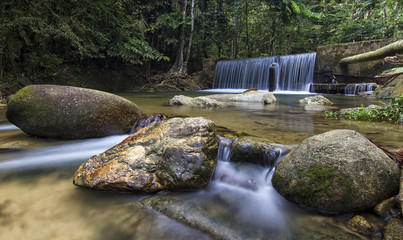 A beautiful waterfall inside tropical rainforest. Long exposure and slow shutter