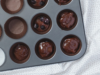The dough for chocolate muffins in forms