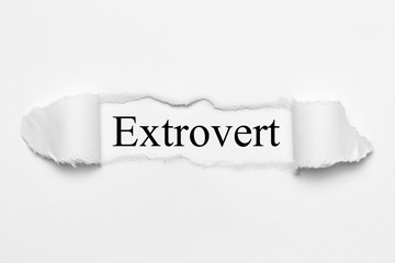 Extrovert on white torn paper