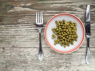 Canned green peas in plate