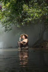 Beautiful woman in traditional dress bathing