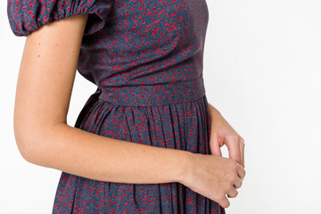 Details of women's clothing. Detail dress on a model on a white background