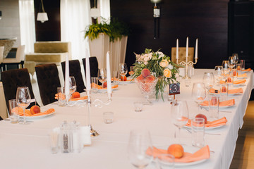Wedding guest table decorated with bouquet and settings