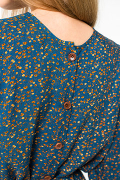 Details of women's clothing. Detail dress on a model on a white background