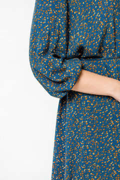 Details of women's clothing. Detail dress on a model on a white background