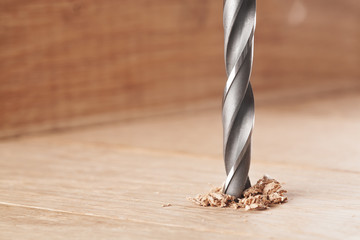 metal drill bit make holes in wooden oaks plank