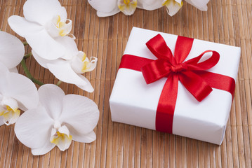 gift and orchid flowers