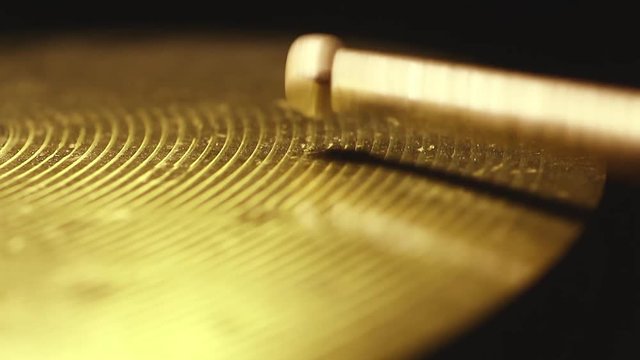 Close up footage of a drum stick hitting a cymbal.