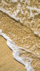 Tranquil waves washing over the beach sand