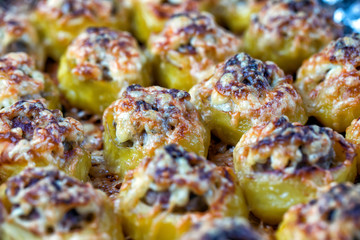 Potato dumplings stuffed with minced meat and served cheese and with sauerkraut and bacon