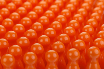Conceptual orange game pawns