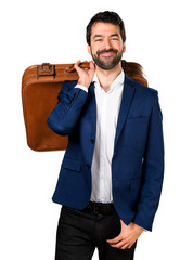 Fototapeta premium Handsome man holding a briefcase